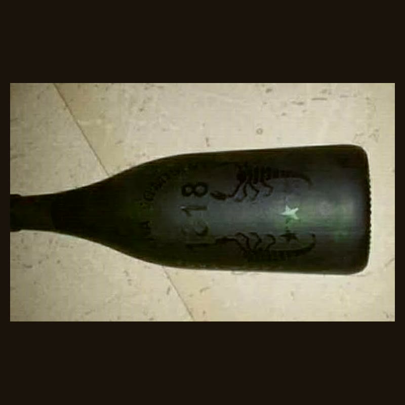 Embossed 1818 Glass Bottle
